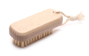 Nail scrubbing brush with wooden handle isolated on white 
