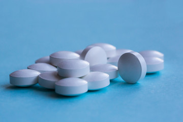 pills isolated on blue  background