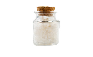 white salt crystals in glass  jar on isolated on white background. front view. spices and food ingredients.
