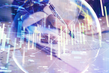 Naklejka premium International business hologram over hands taking notes background. Concept of success. Multi exposure