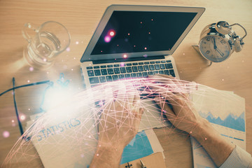 Social network theme hologram with businessman working on computer on background. Concept of world wide web. Double exposure.