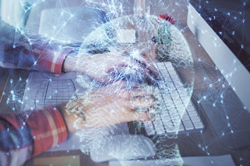 Man typing on keyboard background with brain hologram. Concept of big Data. Double exposure.