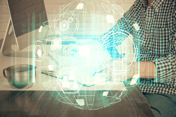Social network theme hologram with businessman working on computer on background. Concept of world wide web. Double exposure.