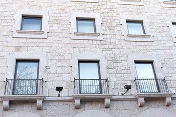 Facade with balconies of an old building in the city e Cuenca Spain