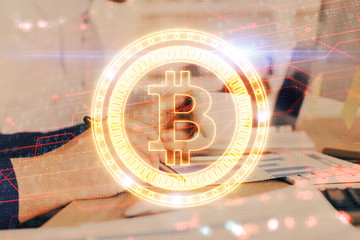 Man's hands working with notes background. Cryptocurrency and finance concept.