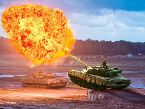 Russian tank T-80 makes a shot at the time of the jump during the show.