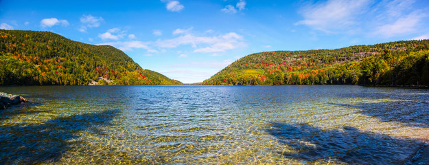 Panoramic view of the rippling water and fall colors of Long Pond in Acadia National Park