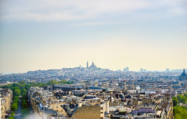 A view of Paris, France from the Arc de Triomphe on a sunny day.