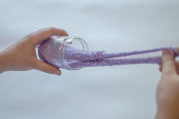 slimes in the hand of a child