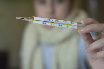 little girl with fever and sneezes