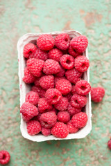 Freshly picked raspberries in box