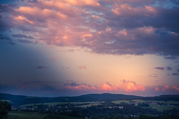 Colorful pink sunset over a rural landscape