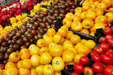 Fruits in supermarket. Supermarket with various colorful fresh vegetables. Tomatoes, capsicum, cucumbers