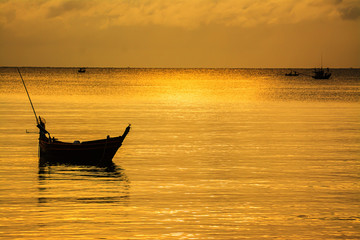 Small fishing boats in  the sea sea in Twilight time