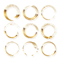 Golden frames made of brush stroke rings isolated on white background. Vector design elements set.