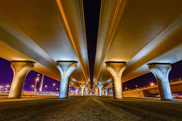 Beautifully illuminated flyover pillars at night 