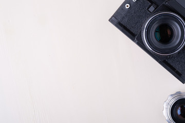 Old vintage retro photo film camera with  lens copy space top view flat lay on white background
