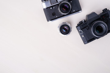 Old vintage retro two photo film camera with lens copy space top view flat lay on white background