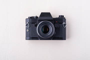 Old vintage retro single black photo film camera copy space top view flat lay on white background