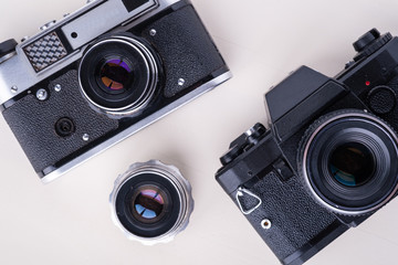 Old vintage retro two photo film camera with lens copy space top view flat lay on white background
