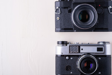 Old vintage retro two photo film camera copy space top view flat lay on white background
