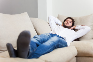 Man relaxing on his sofa
