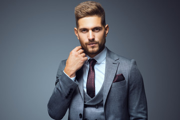 Stylish young man in suit and tie. Business style. Fashionable image. Office worker. Sexy man...
