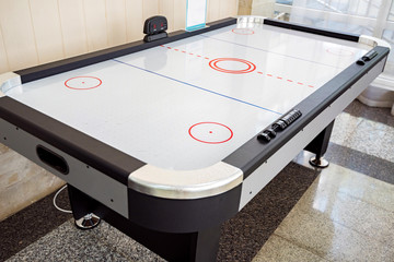 Close up empty air hockey table for playing indoors