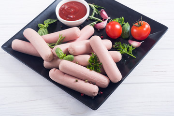 Raw beef sausages with pepper , herbs and ketchup