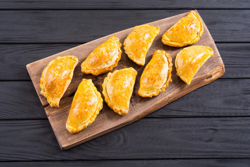 Latin American baked beef empanadas with sauce