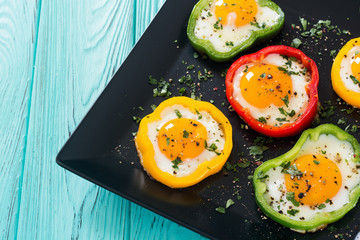 Yellow , red and green pepper with fried eggs