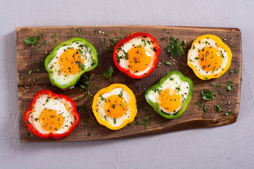 Yellow , red and green pepper with fried eggs
