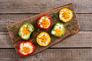 Yellow , red and green pepper with fried eggs