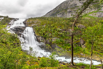 Nyastolfossen waterfall powerful streams in Husedalen valley, Kinsarvik, municipality Ullensvang, Hordaland county, Norway