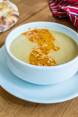 Turkish Lentil Soup with fried butter sauce / Mercimek Corbasi at Restaurant.