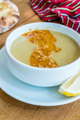 Turkish Lentil Soup with fried butter sauce / Mercimek Corbasi at Restaurant.