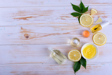 Beautiful layout of cosmetic oils on a wooden background. Natural cosmetics for face and body