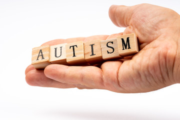 autism word written with wooden cubes