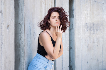 Fototapeta premium Portrait of a young girl with curly hair from Buenos Aires, Argentina. 