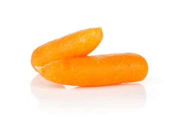 Group of two whole peeled orange baby cut carrot isolated on white background