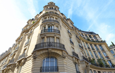 Traditional French house with typical balconies and windows. Paris.