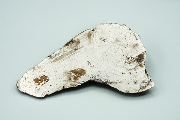 Metallic Meteorite cut isolated, piece of rock formed in outer space in the early stages of Solar...