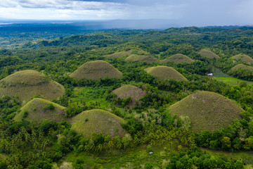 Aerial drone view of the unique landscape of the "Chocolate Hills" area of Bohol in the Philippines