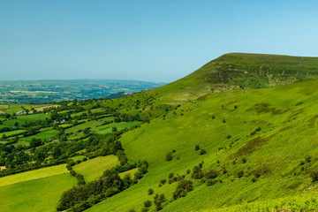 Fototapeta na wymiar Aerial view of green fields and farmlands in rural Wales