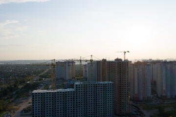 Beautiful urban construction site silhouettes at sunset