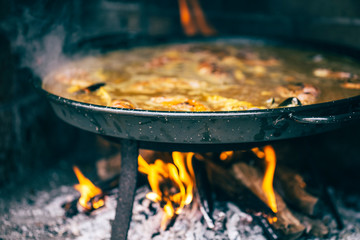Typical spanish paella in the fire