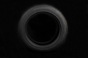 Car tires on black background. Shop Tires and wheels.