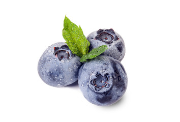 Blueberries with mint leaf and water drops.  Isolated on white. Food concept