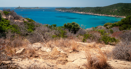 Fototapeta na wymiar Sardinia, Villasimius. View of the beach of Capo Carbonara surrounded by unspoilt nature