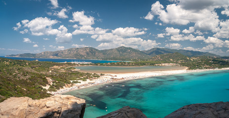 Sardinia, Villasimius. Panoramic view of Porto Giunco beach with turquoise sea water. Porto Giunco is also known as the beach of the two seas due to the presence of the Nottieri pond behind the beach